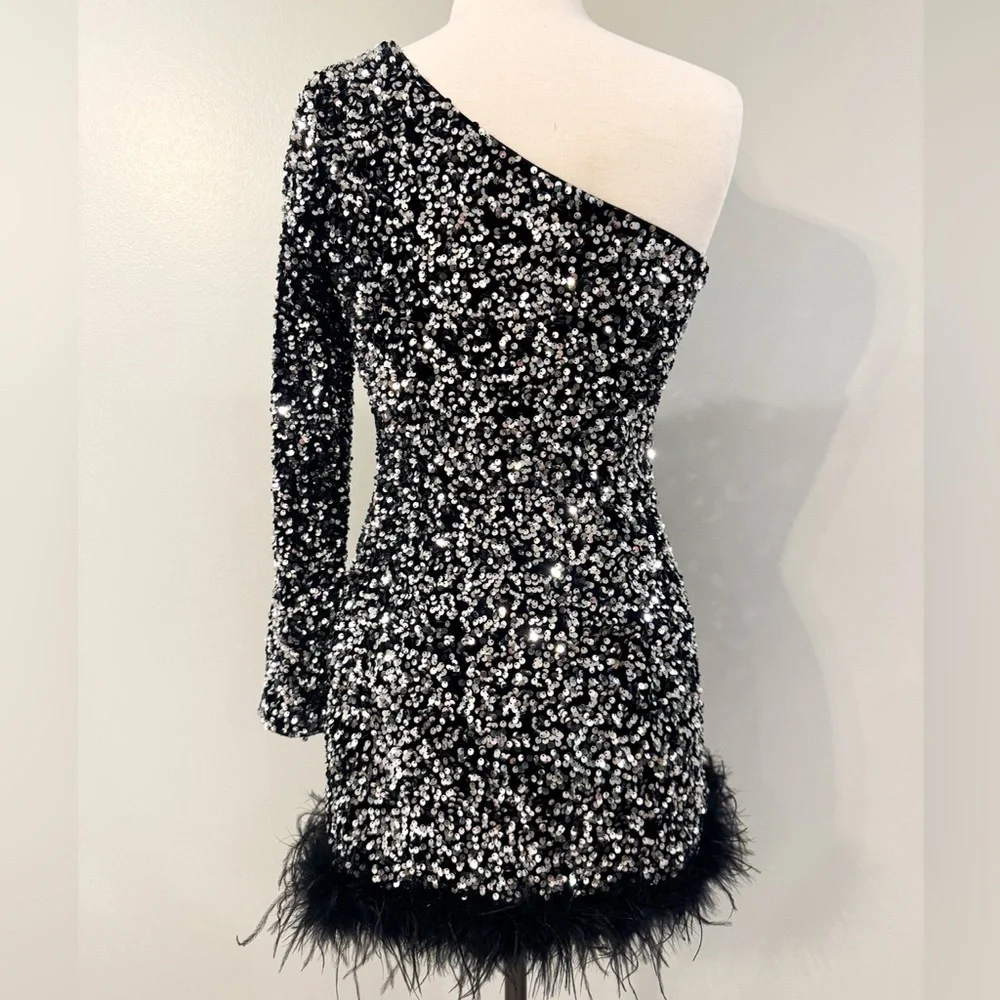 Better Be size M sequin midi dress with feather bottom. Black silver